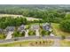 A beautiful neighborhood showcases well-manicured lawns, mature trees, and inviting homes in a peaceful setting at 9303 Raven Top Dr, Mint Hill, NC 28227