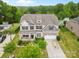 Sprawling two story home showcasing a pool, landscaped yard, and neutral color palette at 9303 Raven Top Dr, Mint Hill, NC 28227
