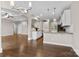 Open kitchen with island and breakfast bar, white cabinetry, and stainless steel appliances at 9303 Raven Top Dr, Mint Hill, NC 28227