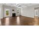 Spacious living room with a fireplace, coffered ceilings, and access to the outside deck at 9303 Raven Top Dr, Mint Hill, NC 28227