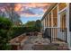 Charming backyard patio with stone paving, outdoor seating, and lush greenery at 9803 Tree Canopy Rd, Charlotte, NC 28277
