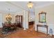 Elegant dining room boasts hardwood floors, decorative lighting, and classic furnishings, great for entertaining at 9803 Tree Canopy Rd, Charlotte, NC 28277