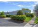 Charming home with a well-manicured lawn and lush green hedges at 9803 Tree Canopy Rd, Charlotte, NC 28277