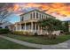 Beautiful home featuring a spacious front porch, lush landscaping, and classic curb appeal at 9803 Tree Canopy Rd, Charlotte, NC 28277