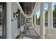 Covered porch featuring classic columns and rocking chairs for relaxing outdoors at 9803 Tree Canopy Rd, Charlotte, NC 28277