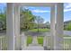 Inviting view from the porch, framing a picturesque neighborhood scene at 9803 Tree Canopy Rd, Charlotte, NC 28277
