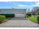 Spacious two-car garage with a clean, modern design and ample driveway space at 9803 Tree Canopy Rd, Charlotte, NC 28277