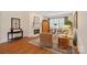 Inviting living room features a fireplace, hardwood floors, shuttered windows, and comfortable seating at 9803 Tree Canopy Rd, Charlotte, NC 28277