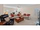 Inviting living area with comfortable seating, soft carpet, and a ceiling fan at 9803 Tree Canopy Rd, Charlotte, NC 28277