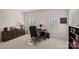 Well-lit office space with desk, chair, storage cabinet, and bright windows at 9803 Tree Canopy Rd, Charlotte, NC 28277