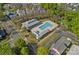 Aerial view of community pool with large pool, shade pavilion and parking lot at 9803 Tree Canopy Rd, Charlotte, NC 28277
