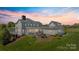 The backyard has a stone firepit area with lots of seating perfect for entertaining Gathering and friends at 1065 Hunter Bridge Rd, Stony Point, NC 28678