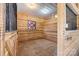 Well-maintained horse stall with wood paneling, metal bars, and ample space for a horse at 1065 Hunter Bridge Rd, Stony Point, NC 28678