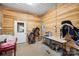 Organized tack room with saddles, gear, and a sink for convenience in caring for equipment at 1065 Hunter Bridge Rd, Stony Point, NC 28678