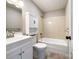 Bathroom featuring a single sink vanity, toilet, storage cabinet, and shower-over-tub at 109 Georgia Belle Ave # 199, Belmont, NC 28012