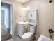 Bathroom featuring a single sink vanity, toilet, storage cabinet, and shower-over-tub at 109 Georgia Belle Ave # 199, Belmont, NC 28012