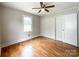 Bright bedroom featuring hardwood floors, neutral paint, and ample closet space at 109 Georgia Belle Ave # 199, Belmont, NC 28012