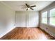 Bedroom featuring hardwood floors, neutral paint, and a pair of large closets at 109 Georgia Belle Ave # 199, Belmont, NC 28012