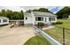 Exterior view of the home with a connected carport, fenced yard, and well maintained landscaping at 109 Georgia Belle Ave # 199, Belmont, NC 28012