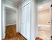 Hallway with closet situated between openings to a bedroom and a bathroom with shower and toilet at 109 Georgia Belle Ave # 199, Belmont, NC 28012