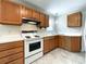 Efficient kitchen layout with wooden cabinets and ample countertop space at 109 Georgia Belle Ave # 199, Belmont, NC 28012