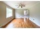 Sunlit living room features hardwood floors, a classic ceiling fan, and bright natural lighting at 109 Georgia Belle Ave # 199, Belmont, NC 28012