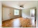 Bright living room featuring hardwood floors, a ceiling fan, and natural light from the window at 109 Georgia Belle Ave # 199, Belmont, NC 28012