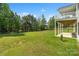 Backyard view of the two-story home and a large green yard at 11228 Island View Ln, Lancaster, SC 29720