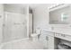 Bright bathroom features a glass shower, white vanity and fixtures, and tile flooring at 11228 Island View Ln, Lancaster, SC 29720