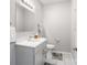 Neutral powder bath with white vanity, commode, framed mirror, and tile flooring at 11228 Island View Ln, Lancaster, SC 29720