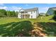 Rear exterior of home shows large yard, covered patio and balcony at 11228 Island View Ln, Lancaster, SC 29720