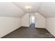 Finished attic space featuring carpet and a dormer window at 115 Players Park Cir, Statesville, NC 28677