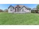 Expansive backyard featuring a deck and lush green lawn, ideal for outdoor activities and relaxation at 115 Players Park Cir, Statesville, NC 28677