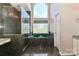 Bright bathroom featuring a luxurious jacuzzi tub, stand up shower, and lots of natural light at 115 Players Park Cir, Statesville, NC 28677