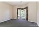 Bedroom with neutral walls, carpet, and a large bay window with decorative valances at 115 Players Park Cir, Statesville, NC 28677