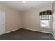 Simple bedroom with plush carpet and neutral colored walls at 115 Players Park Cir, Statesville, NC 28677
