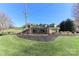 Elegant stone entrance to the community, featuring manicured landscaping and a welcoming atmosphere at 115 Players Park Cir, Statesville, NC 28677