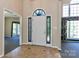 Welcoming foyer with tile flooring, decorative front door, and views into other rooms at 115 Players Park Cir, Statesville, NC 28677