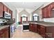 Well-equipped kitchen with granite countertops and stainless steel appliances at 115 Players Park Cir, Statesville, NC 28677