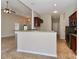 Open kitchen with granite countertops and stainless steel appliances at 115 Players Park Cir, Statesville, NC 28677