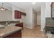 Kitchen featuring granite countertops, stainless steel sink, and tile floor at 115 Players Park Cir, Statesville, NC 28677