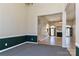 Open-concept living space featuring carpet, fireplace, and seamless flow into adjacent areas at 115 Players Park Cir, Statesville, NC 28677