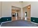 Open-concept living space featuring carpet, fireplace, and seamless flow into adjacent areas at 115 Players Park Cir, Statesville, NC 28677