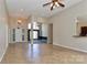 Open-concept living room with tile flooring and ample natural light at 115 Players Park Cir, Statesville, NC 28677