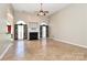 Bright living room featuring tile floors, a fireplace, and large windows at 115 Players Park Cir, Statesville, NC 28677
