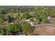 An aerial view showcasing a charming home with a long driveway nestled among mature trees and green surroundings at 1195 Ralph B Keener Rd, Lincolnton, NC 28092