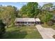 Aerial view of a brick home, showing the metal roof, a manicured yard, and mature trees at 1195 Ralph B Keener Rd, Lincolnton, NC 28092