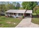 Aerial view of the charming brick home with metal roof and long driveway at 1195 Ralph B Keener Rd, Lincolnton, NC 28092