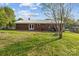 The backyard of this home features an open lawn and a brick exterior at 1195 Ralph B Keener Rd, Lincolnton, NC 28092