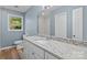 Bright bathroom featuring granite countertop, white cabinets, and new tiled shower at 1195 Ralph B Keener Rd, Lincolnton, NC 28092